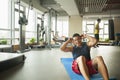 Young man doing sit-ups in the gym Royalty Free Stock Photo