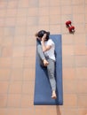 Young man doing sit-ups on mat Royalty Free Stock Photo