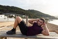 Young man doing sit-ups outdoor Royalty Free Stock Photo