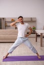 Young man doing sport exercises at home Royalty Free Stock Photo