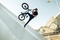 Young man doing street tricks with a bmx