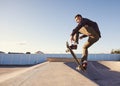 A rad day at the skate park. A young man doing tricks on his skateboard at the skate park. Royalty Free Stock Photo