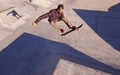 A rad day at the skate park. A young man doing tricks on his skateboard at the skate park. Royalty Free Stock Photo