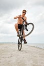 Young man doing wheelie Royalty Free Stock Photo