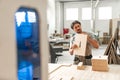 Young man doing woodwork in carpentry factory close up Royalty Free Stock Photo