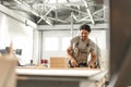 Young man doing woodwork in carpentry factory close up Royalty Free Stock Photo