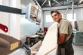 Young man doing woodwork in carpentry factory close up Royalty Free Stock Photo