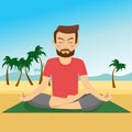 Young man doing yoga on a mat at tropical beach Royalty Free Stock Photo