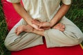 a young man doing yoga in nature, sitting in the lotus position 2 Royalty Free Stock Photo