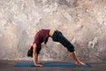 Young man doing yoga or pilates exercise in urban background. Royalty Free Stock Photo