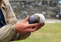 Young man dressed as soldier, holding ammunition used during battle, Fort Ticonderoga, New York, 2016