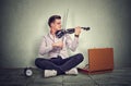 Young man playing on a black electronic violin Royalty Free Stock Photo