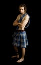 Young man dressed in a scottish kilt Royalty Free Stock Photo