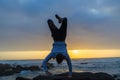 Man Handstand Ocean Rocks Silhouetted Royalty Free Stock Photo