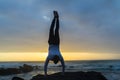 Man Handstand Ocean Rocks Silhouetted Royalty Free Stock Photo