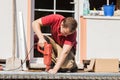 A young man drilling a hole Royalty Free Stock Photo