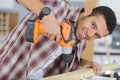 young man drilling wood Royalty Free Stock Photo