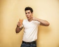 Young man drinking big glass of healthy fruit Royalty Free Stock Photo