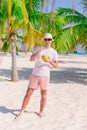 Young man drinking coconut milk during tropical vacation Royalty Free Stock Photo