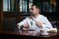 Sad Man drinking coffee in a cafe Royalty Free Stock Photo