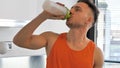 Young man drinking a smoothie drink or a protein shake Royalty Free Stock Photo