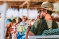 Young man drinking ice coffee in a beach bar Royalty Free Stock Photo