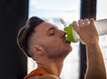 Young man drinking a smoothie drink or a protein shake Royalty Free Stock Photo