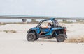 Young man drives extreme on his off-road vehicle