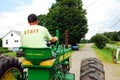 A young man drives his tractor around the farm Royalty Free Stock Photo