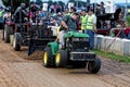 A Young Man Drives at a Lawn Tractor Pull