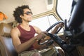 Young Man Driving Campervan