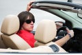 Young man in sunglasses driving convertible car Royalty Free Stock Photo