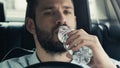 young man driving car and drinking Royalty Free Stock Photo