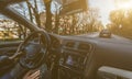 Young man driving a car with one hand. Concentrating and safe driving on the road concept