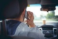 Young man driving a car with phone Royalty Free Stock Photo