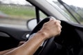 Young man driving a car in a rainy day Royalty Free Stock Photo