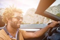 Young man driving a convertible car. Royalty Free Stock Photo