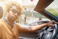 Young man driving a convertible car. Royalty Free Stock Photo