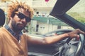 Young man driving a convertible car. Royalty Free Stock Photo