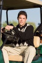 Young Man Driving Golf Cart
