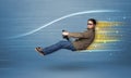 Young man driving in imaginary fast car with blurred lines Royalty Free Stock Photo