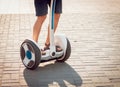 Young man driving on Segway in the park.