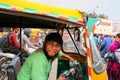 Young man driving tuk-tuk at Kinari Bazaar in Agra, Uttar Pradesh, India Royalty Free Stock Photo