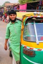 Young man driving tuk-tuk at Kinari Bazaar in Agra, Uttar Pradesh, India Royalty Free Stock Photo