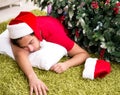 Young man drunk at home after christmas party Royalty Free Stock Photo