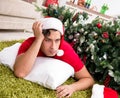 Young man drunk at home after christmas party Royalty Free Stock Photo