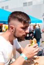 A young man eating a burger