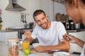Young man eating cereal at breakfast Royalty Free Stock Photo