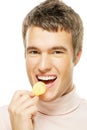 Young man eating chips Royalty Free Stock Photo
