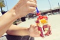 Young man eating a fruit salad outdoors Royalty Free Stock Photo